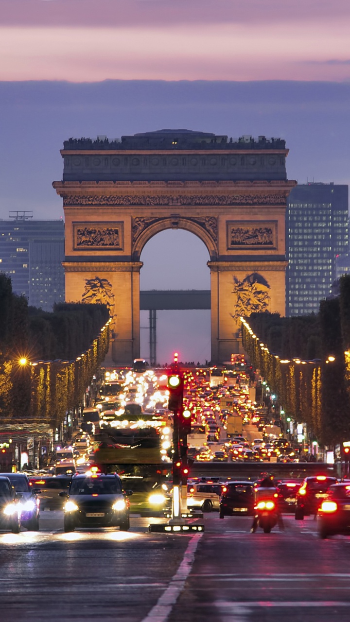 Cars on Road Near Arch Gate During Night Time. Wallpaper in 720x1280 Resolution