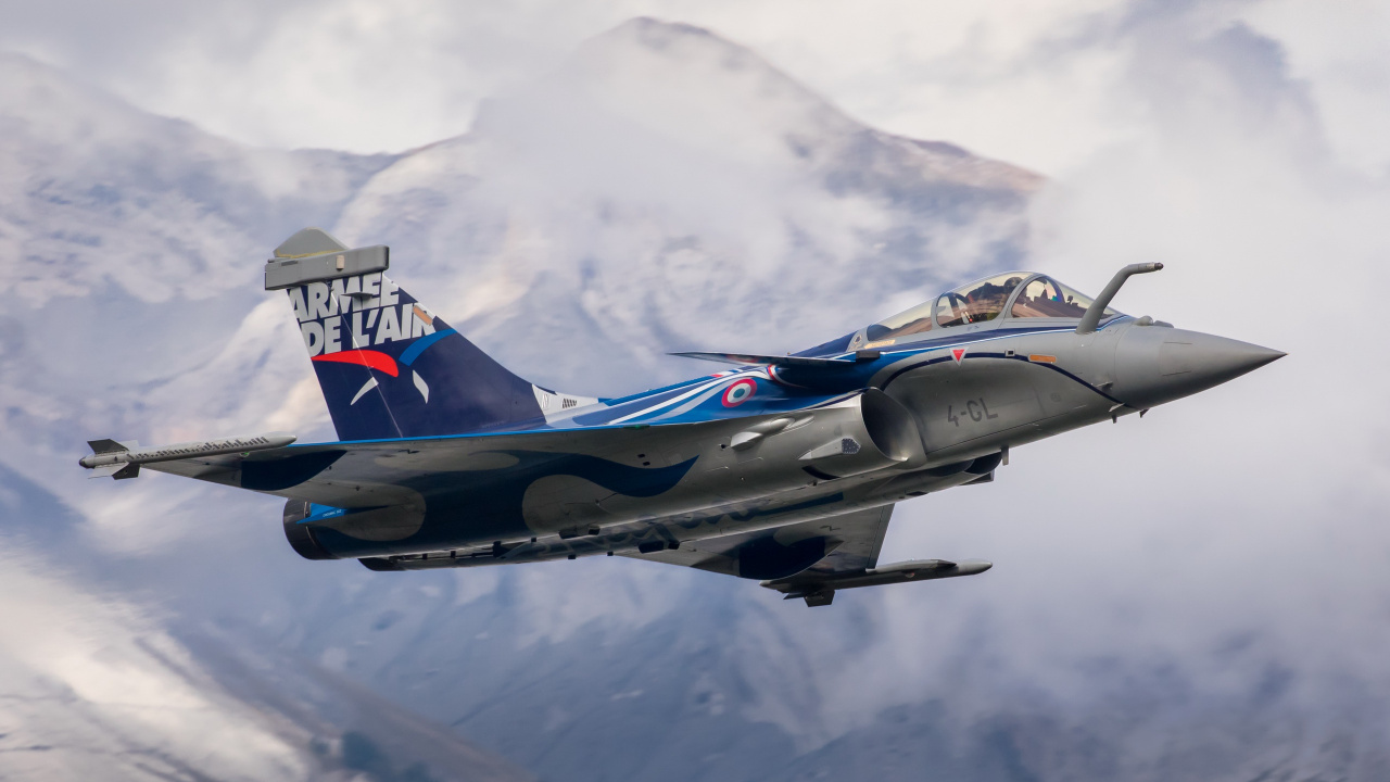Blue and White Jet Plane Flying Over The Mountain. Wallpaper in 1280x720 Resolution