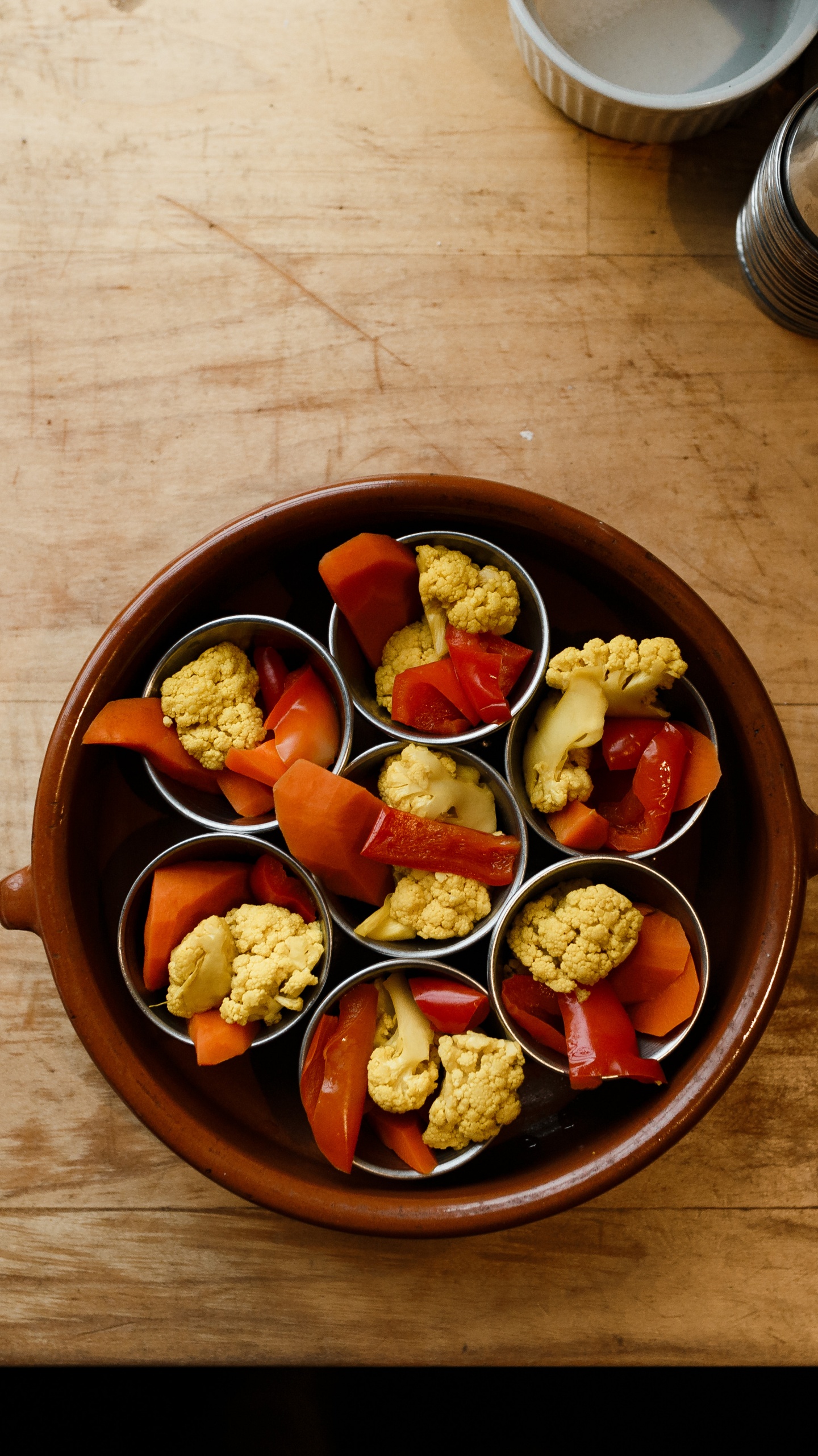 Sliced Fruits in Brown Bowl. Wallpaper in 1440x2560 Resolution