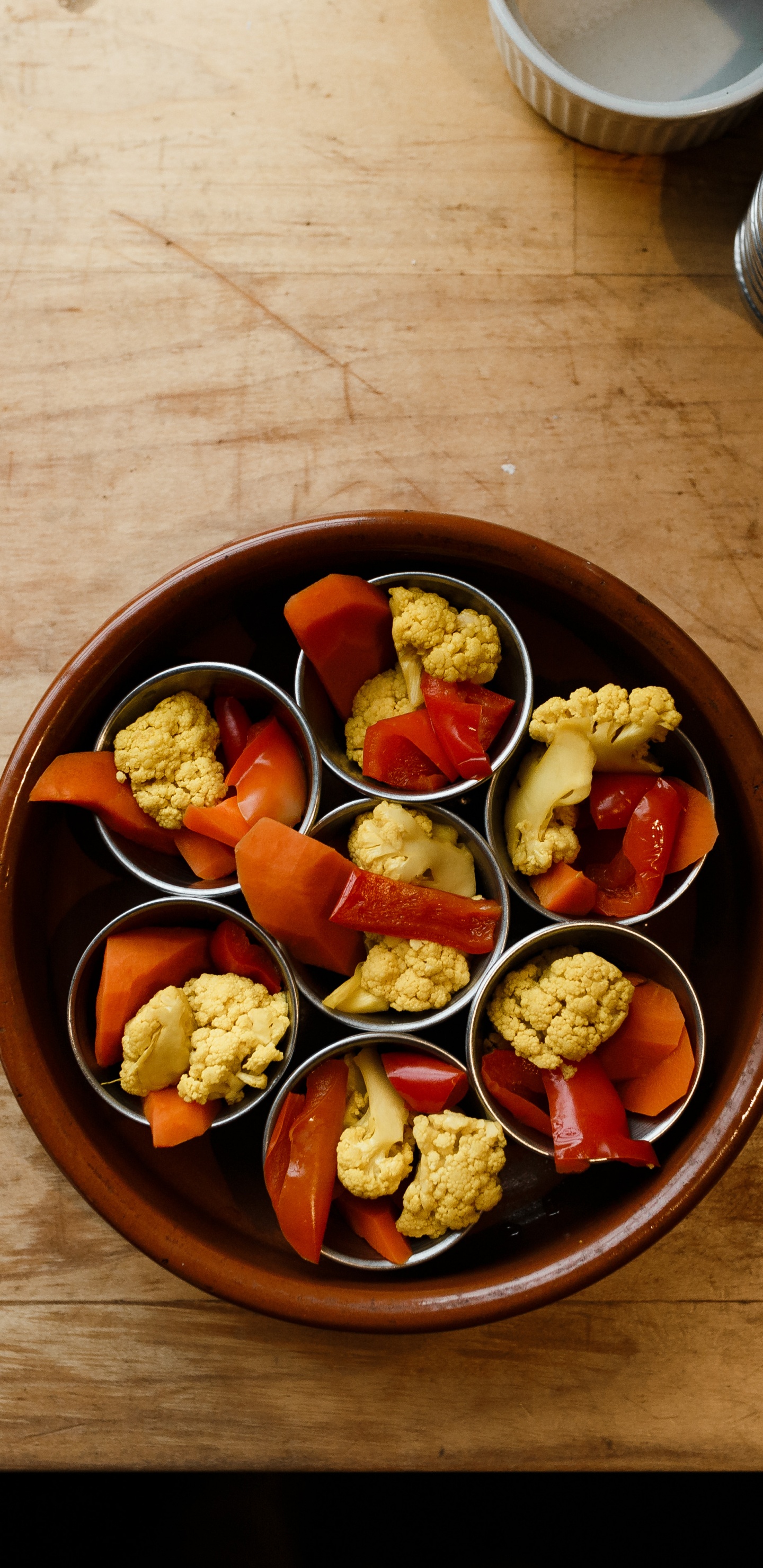 Sliced Fruits in Brown Bowl. Wallpaper in 1440x2960 Resolution