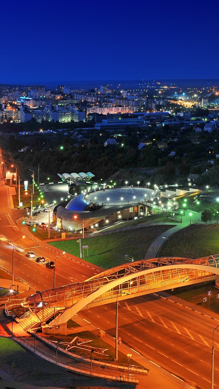City With Lights Turned on During Night Time. Wallpaper in 720x1280 Resolution