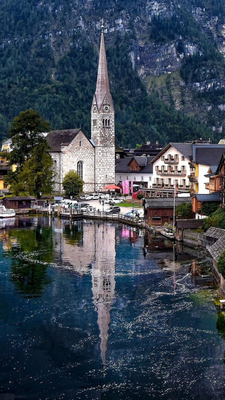 Brown and White Concrete Building Beside River During Daytime. Wallpaper in 720x1280 Resolution