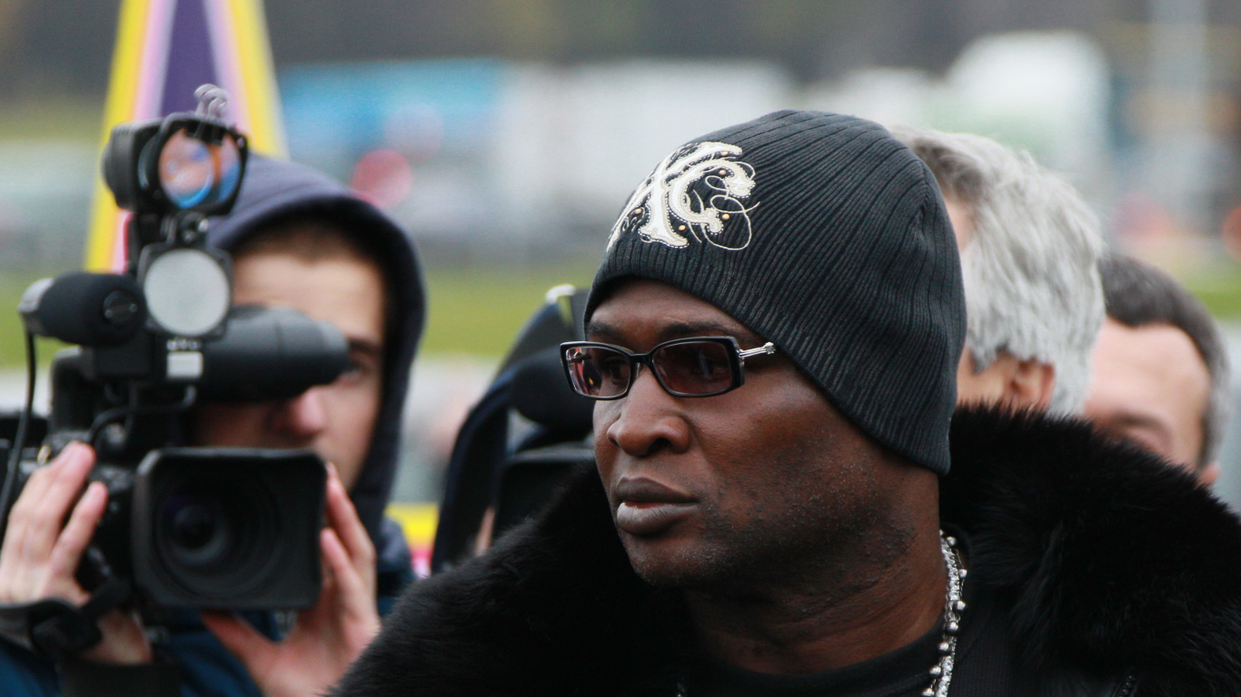 Man in Black Sunglasses and Black and White Knit Cap. Wallpaper in 1366x768 Resolution