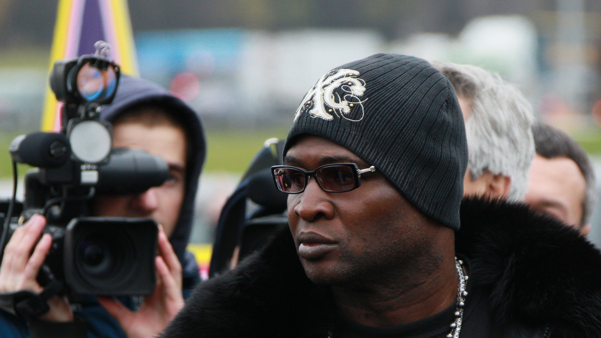 Man in Black Sunglasses and Black and White Knit Cap. Wallpaper in 1920x1080 Resolution