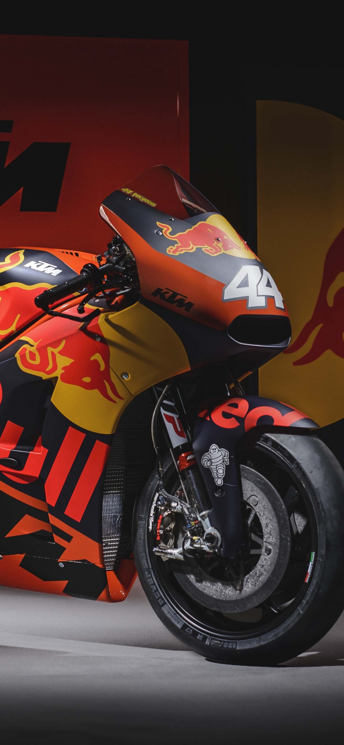 Bicicleta Deportiva Naranja y Negra. Wallpaper in 1125x2436 Resolution