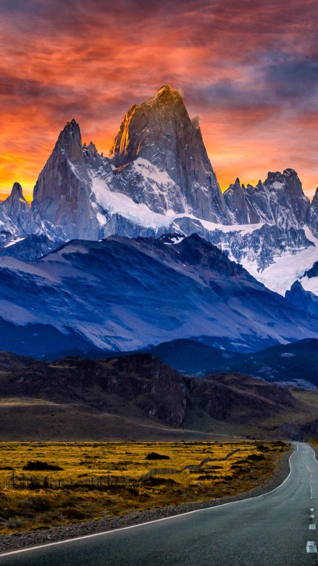 Gray Asphalt Road Near Snow Covered Mountain During Daytime. Wallpaper in 1080x1920 Resolution