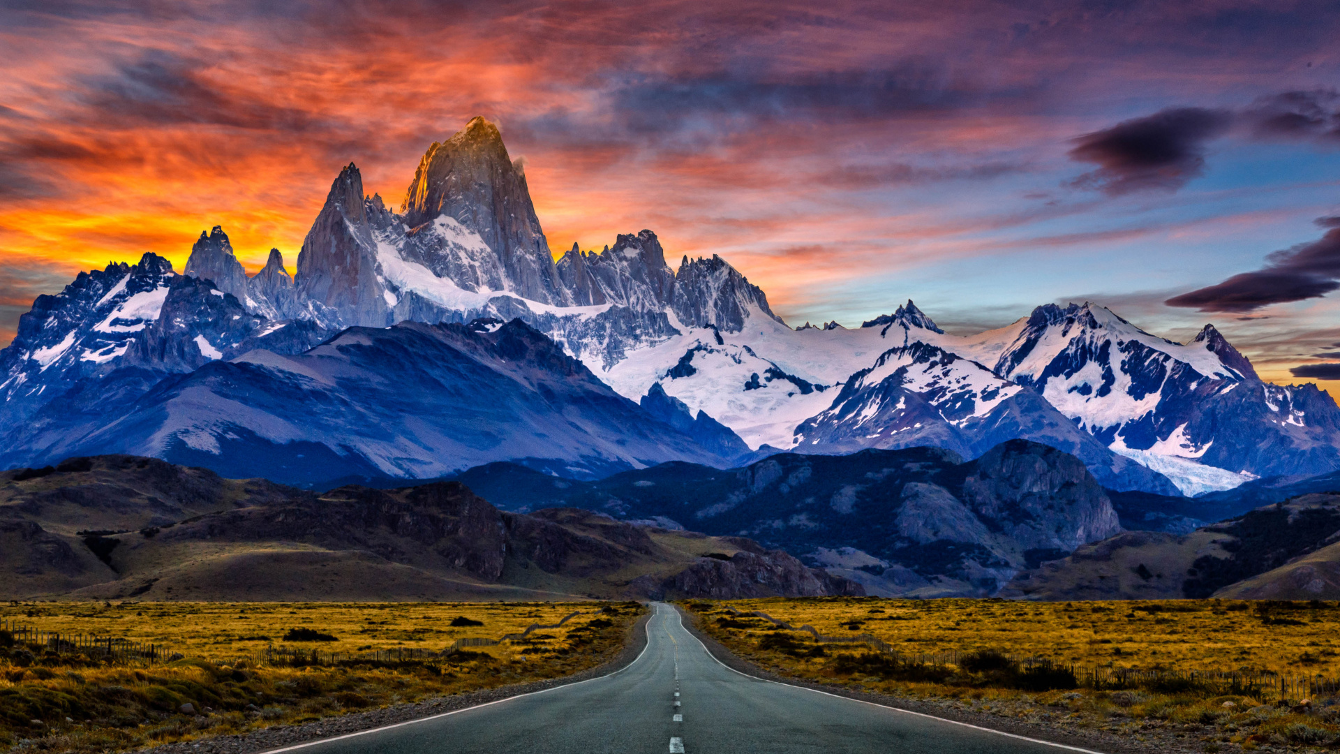 Gray Asphalt Road Near Snow Covered Mountain During Daytime. Wallpaper in 1920x1080 Resolution
