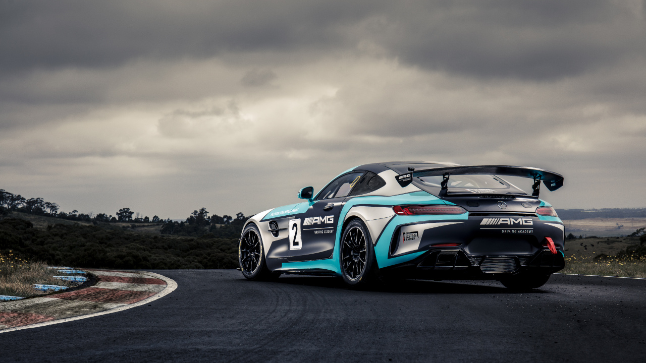 Blue and White Bmw m 3 Coupe on Black Asphalt Road Under Gray Cloudy Sky. Wallpaper in 1280x720 Resolution