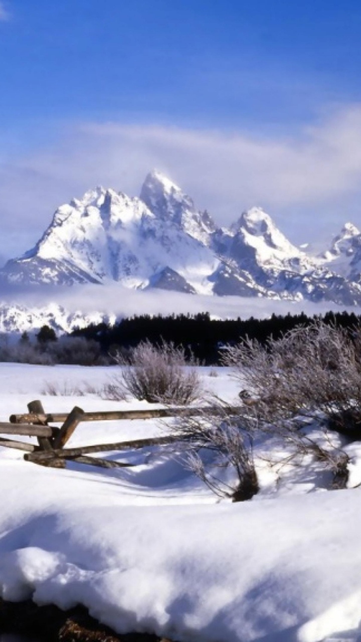 Snow Covered Mountain Under Cloudy Sky During Daytime. Wallpaper in 720x1280 Resolution