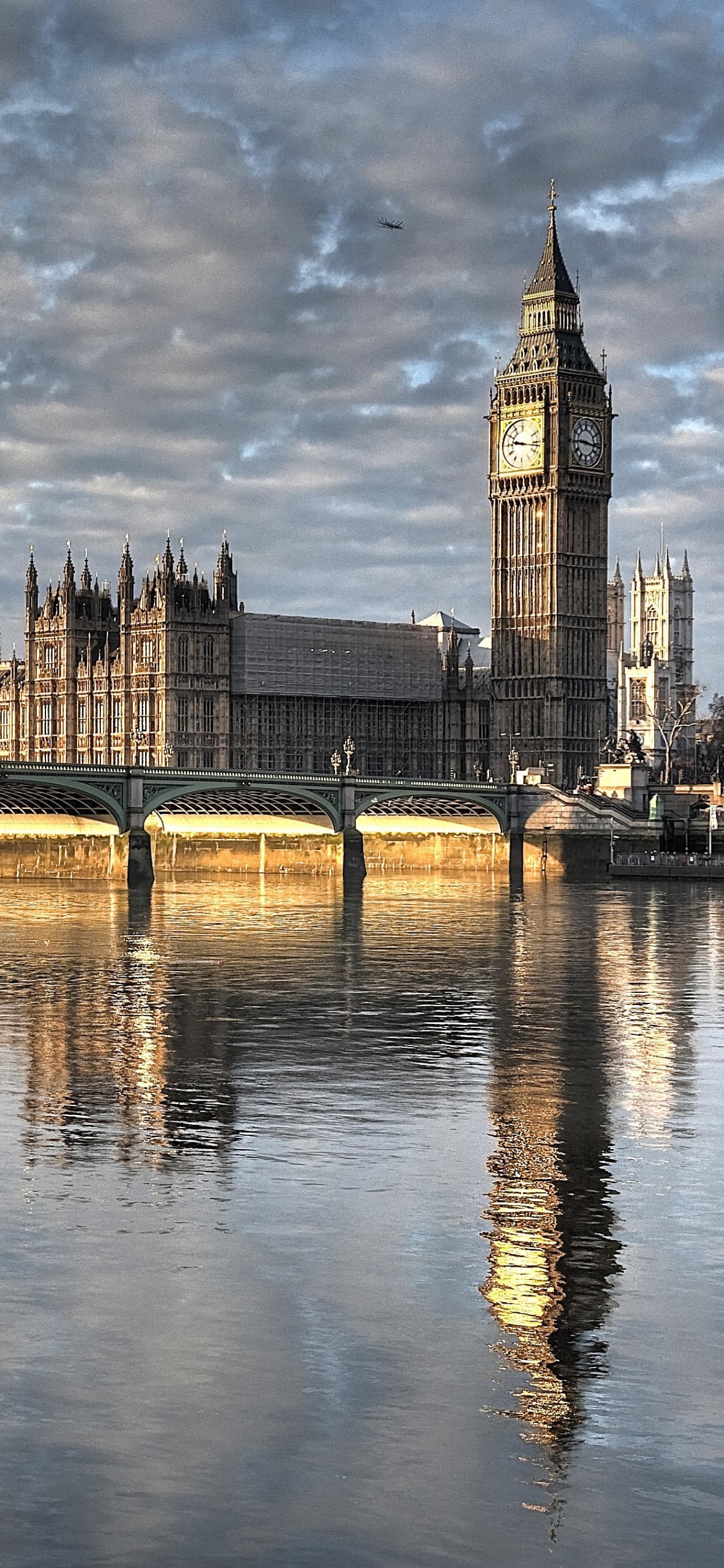 Brown Concrete Bridge Over River During Daytime. Wallpaper in 1242x2688 Resolution