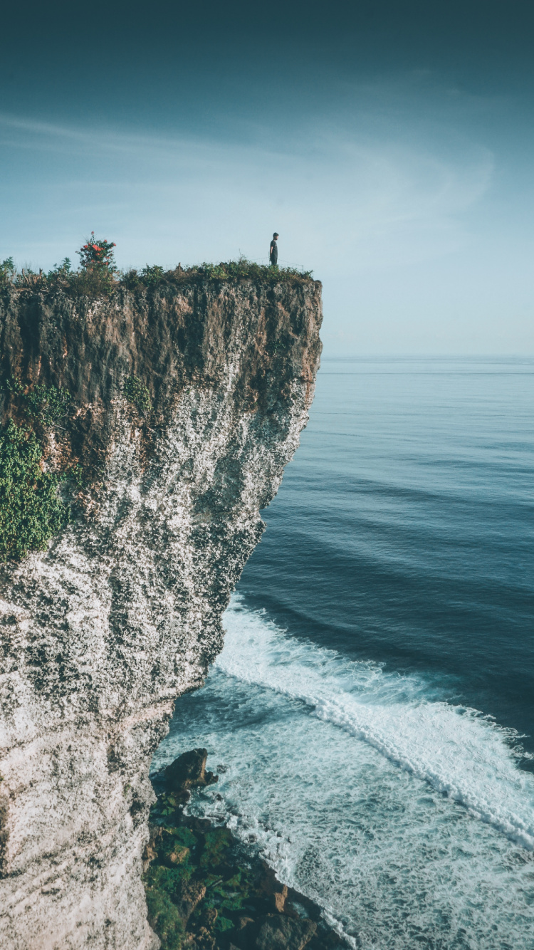 Karang Boma Cliff, Promontory, Human, Cliff, Terrain. Wallpaper in 750x1334 Resolution