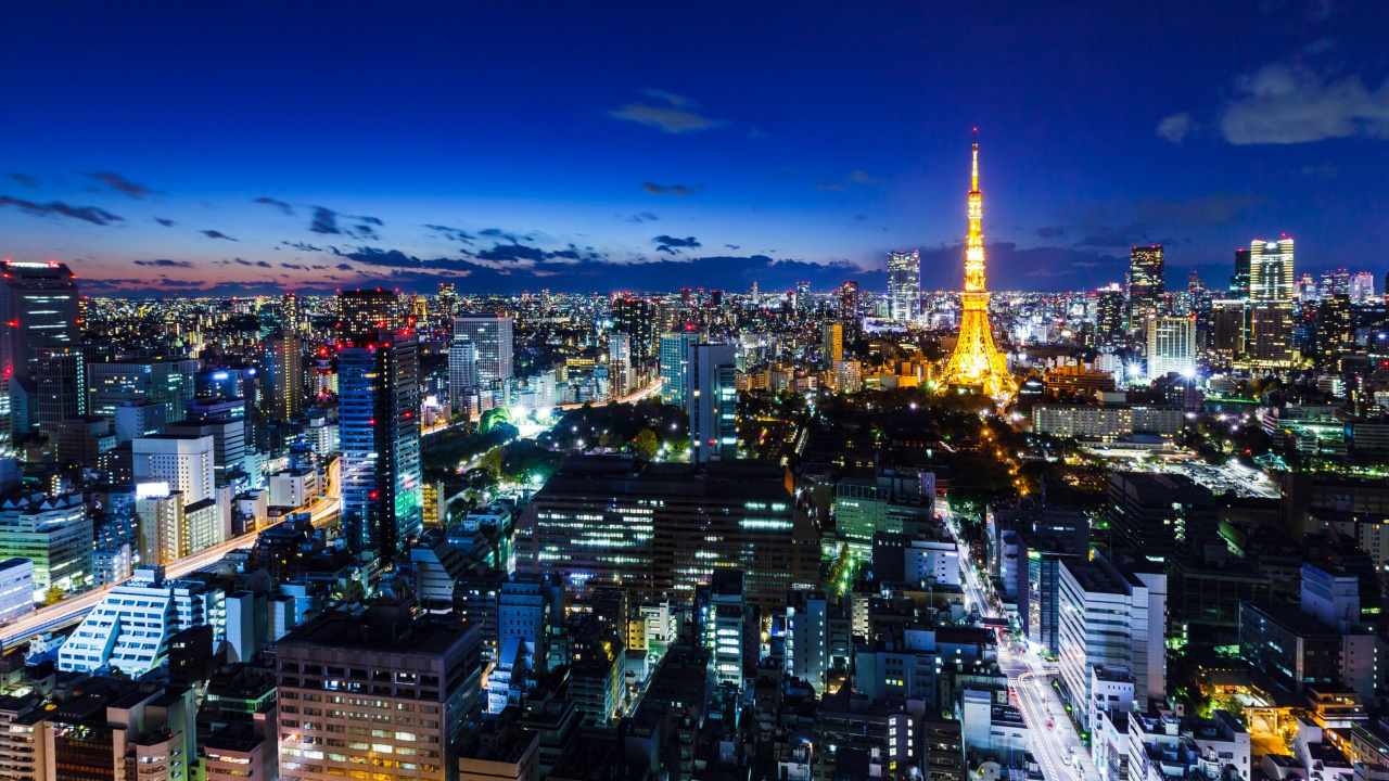 Ville Avec Des Immeubles de Grande Hauteur Pendant la Nuit. Wallpaper in 1280x720 Resolution