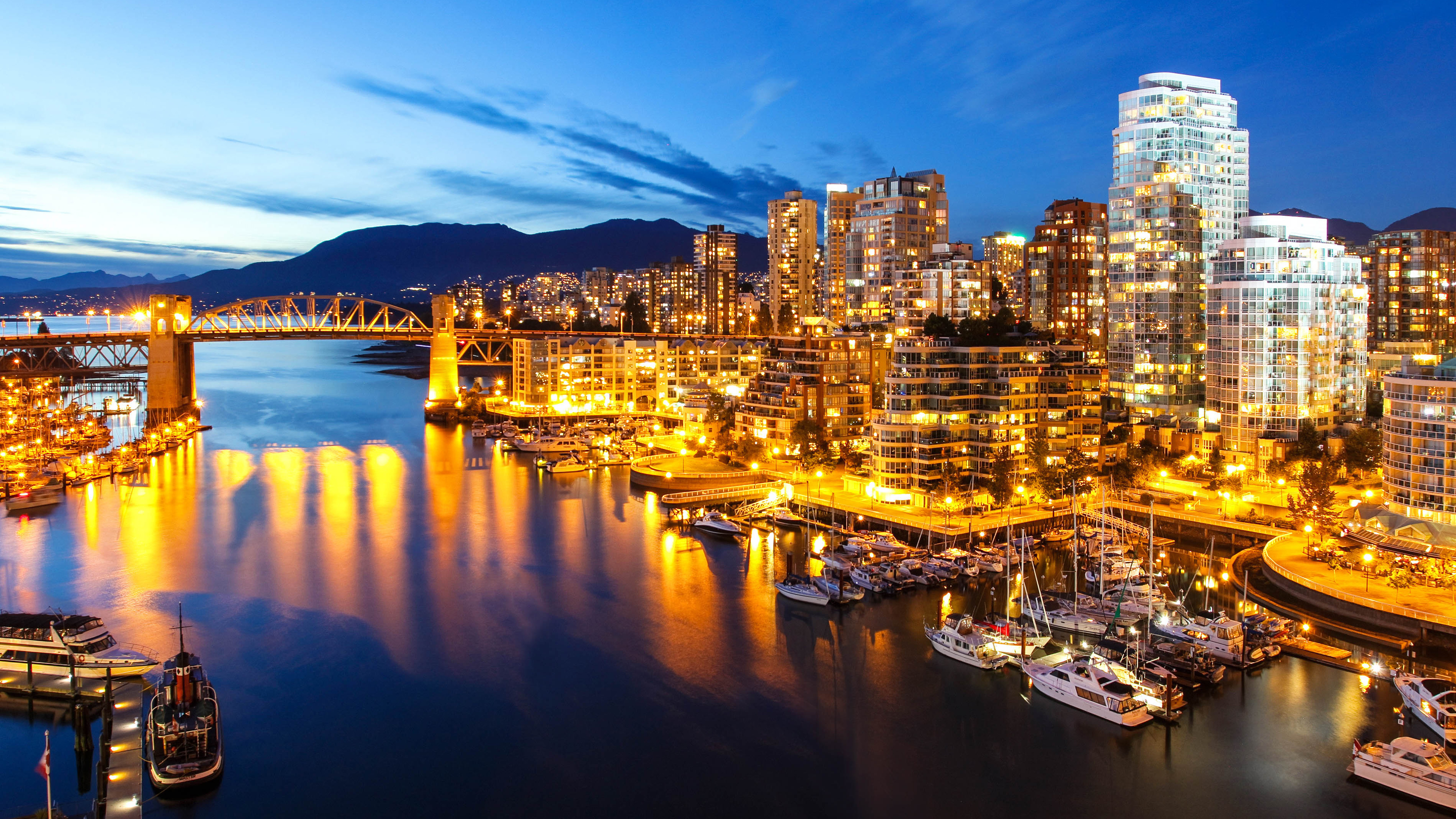 City Skyline Across Body of Water During Night Time. Wallpaper in 3840x2160 Resolution