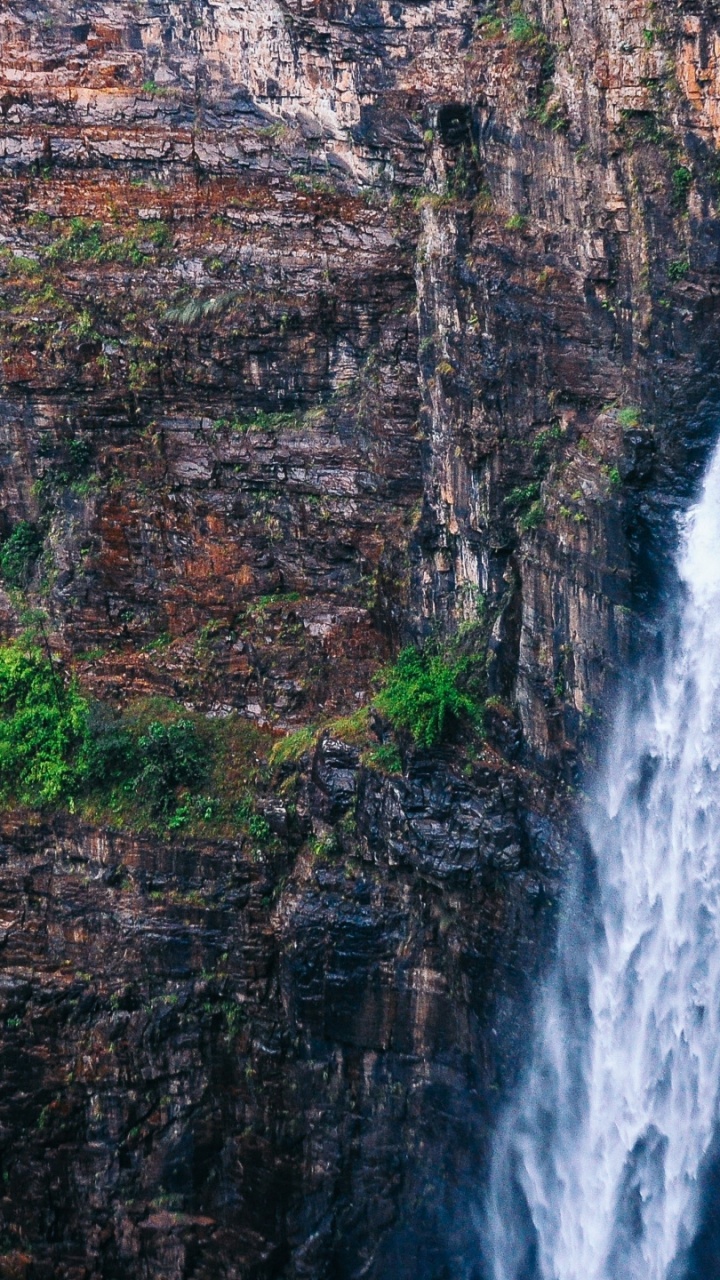 Waterfalls in Brown Rocky Mountain During Daytime. Wallpaper in 720x1280 Resolution