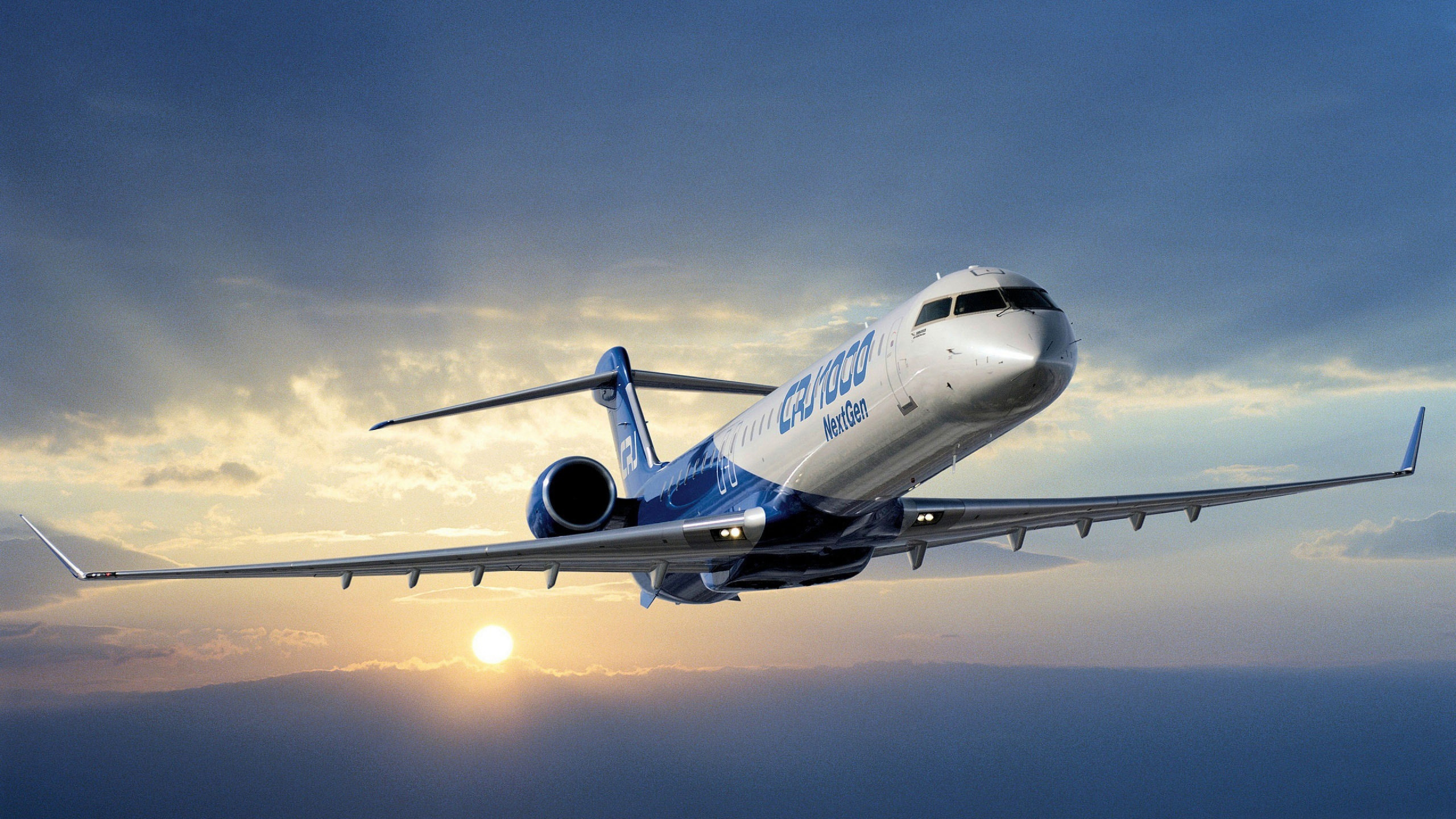 White and Blue Passenger Plane in Flight. Wallpaper in 2560x1440 Resolution