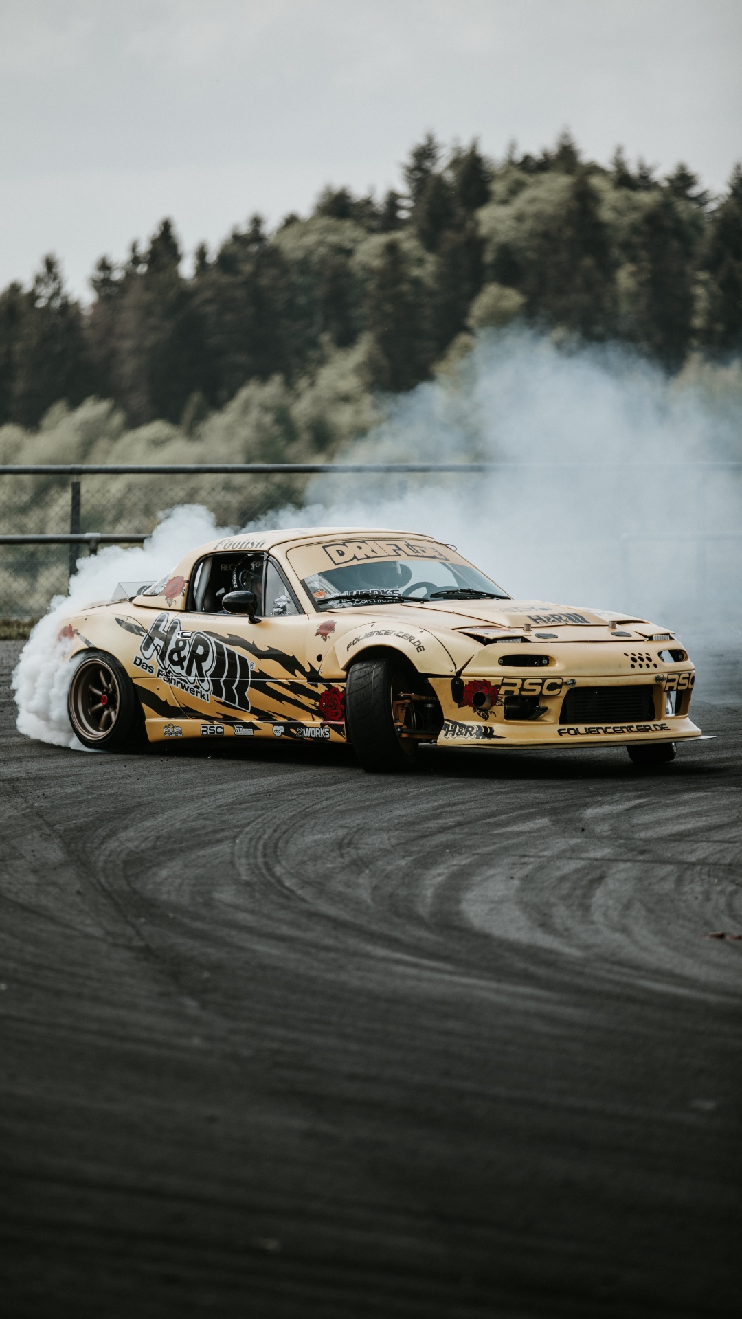 Yellow and Black Chevrolet Camaro on Track. Wallpaper in 1080x1920 Resolution