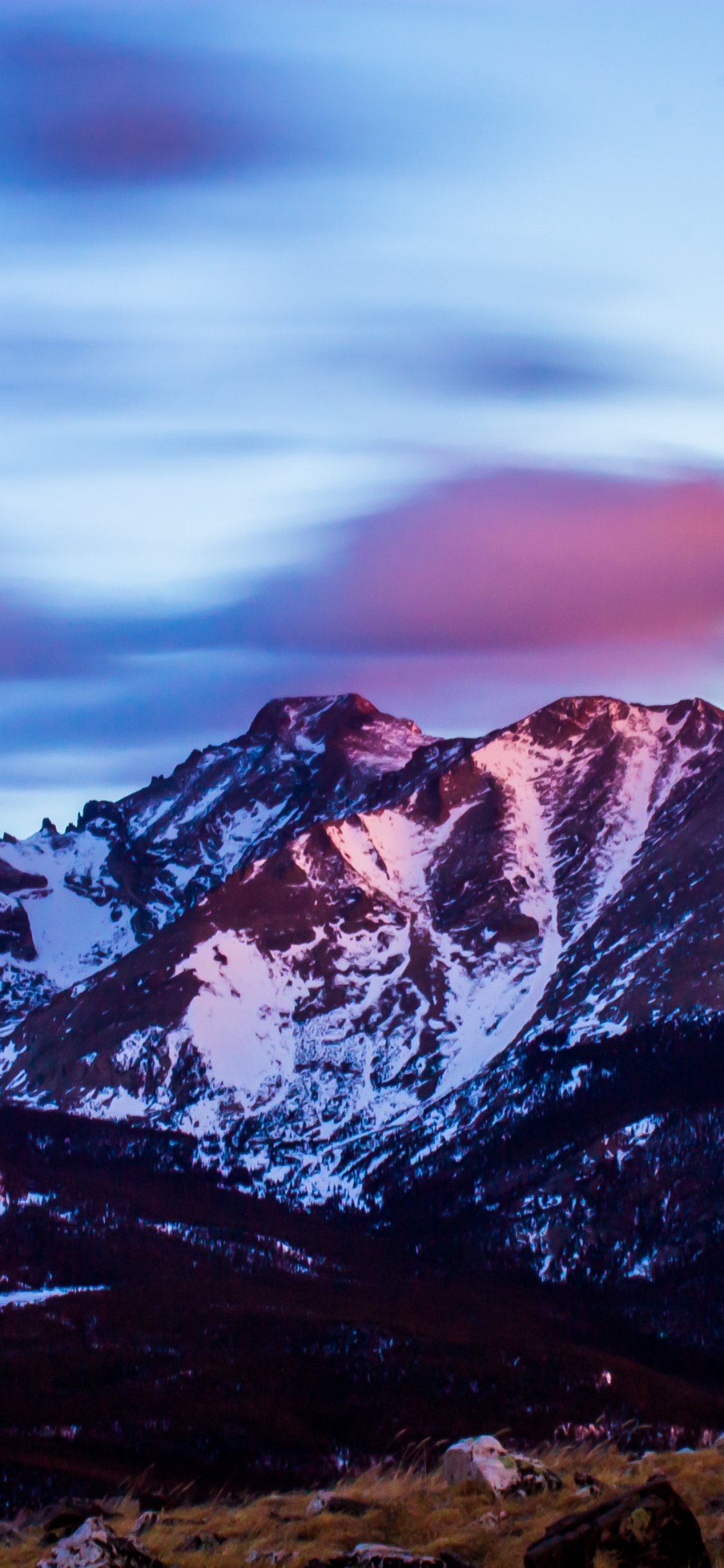 Brown and White Mountains Under Cloudy Sky During Daytime. Wallpaper in 1125x2436 Resolution