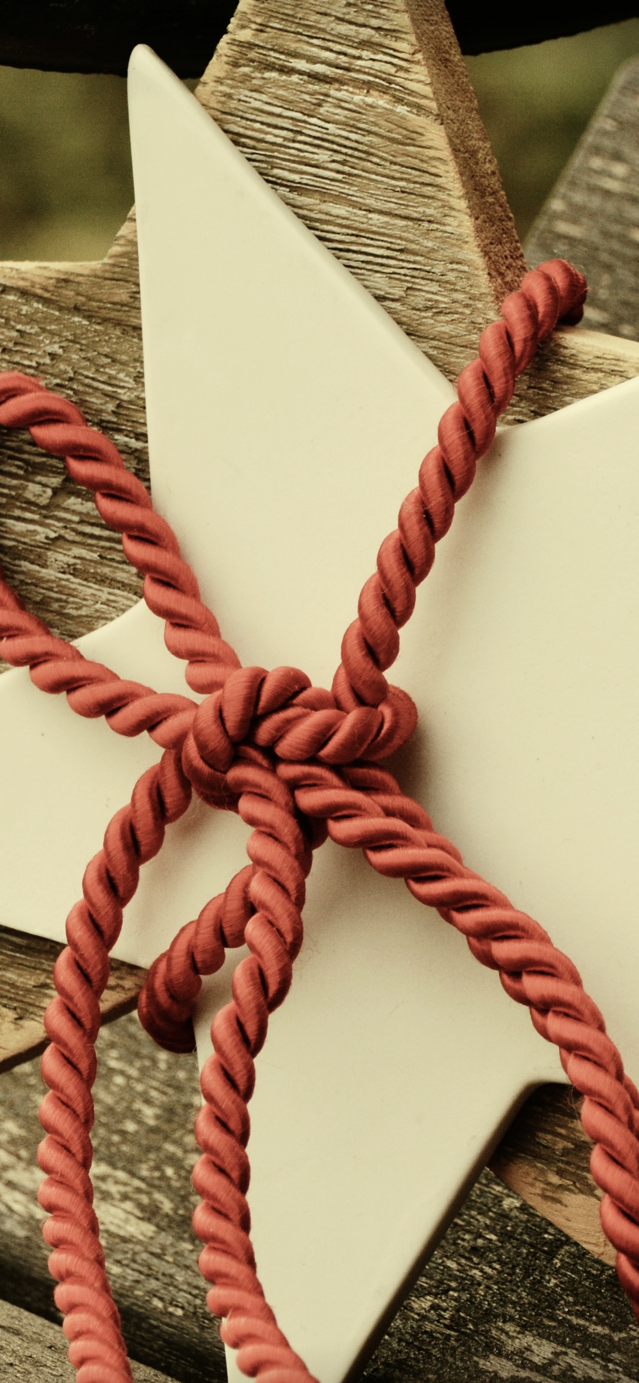 White and Red Ribbon on Brown Wooden Plank. Wallpaper in 1242x2688 Resolution