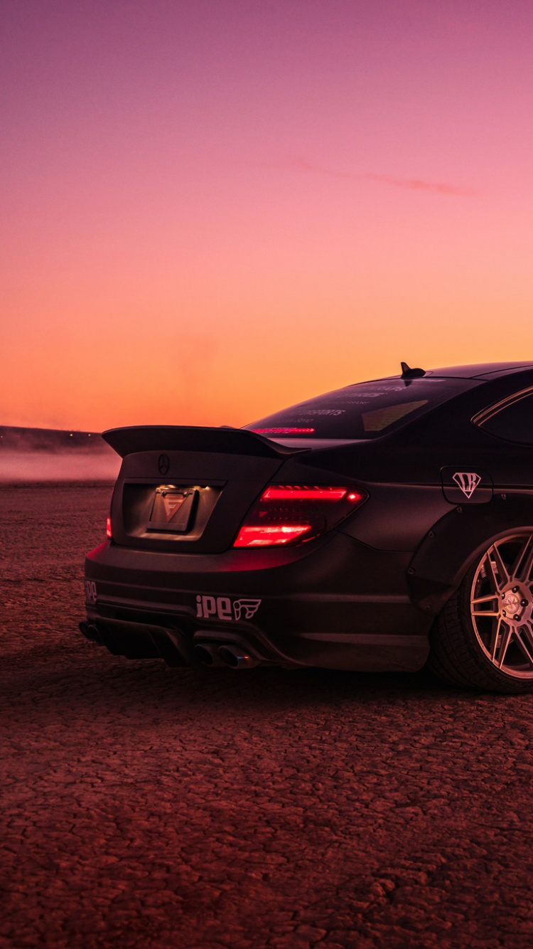 Black Porsche 911 on Brown Sand During Daytime. Wallpaper in 750x1334 Resolution