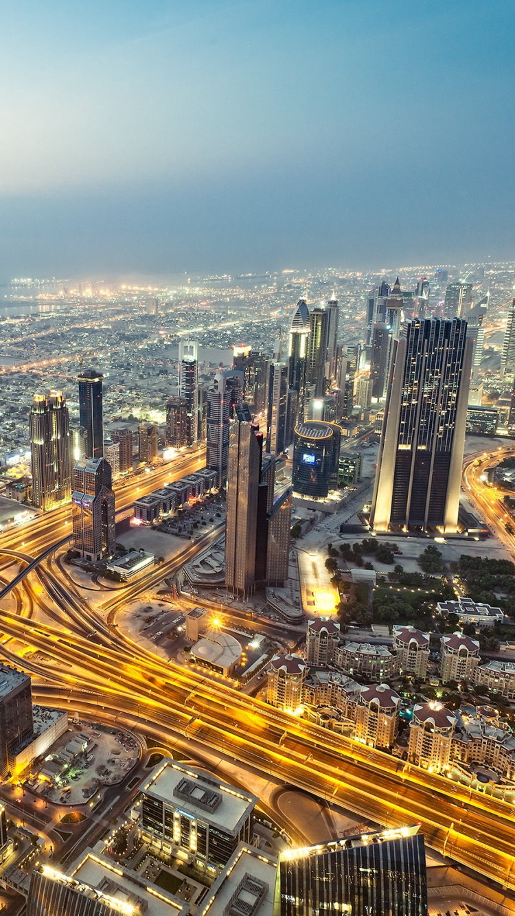 Aerial View of City Buildings During Night Time. Wallpaper in 750x1334 Resolution