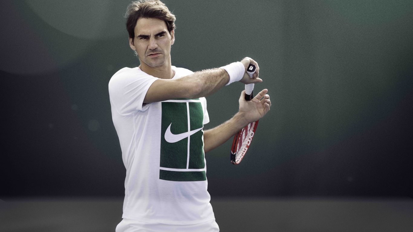 Man in Green and White Nike Jersey Shirt Holding Red and White Tennis Racket. Wallpaper in 1366x768 Resolution