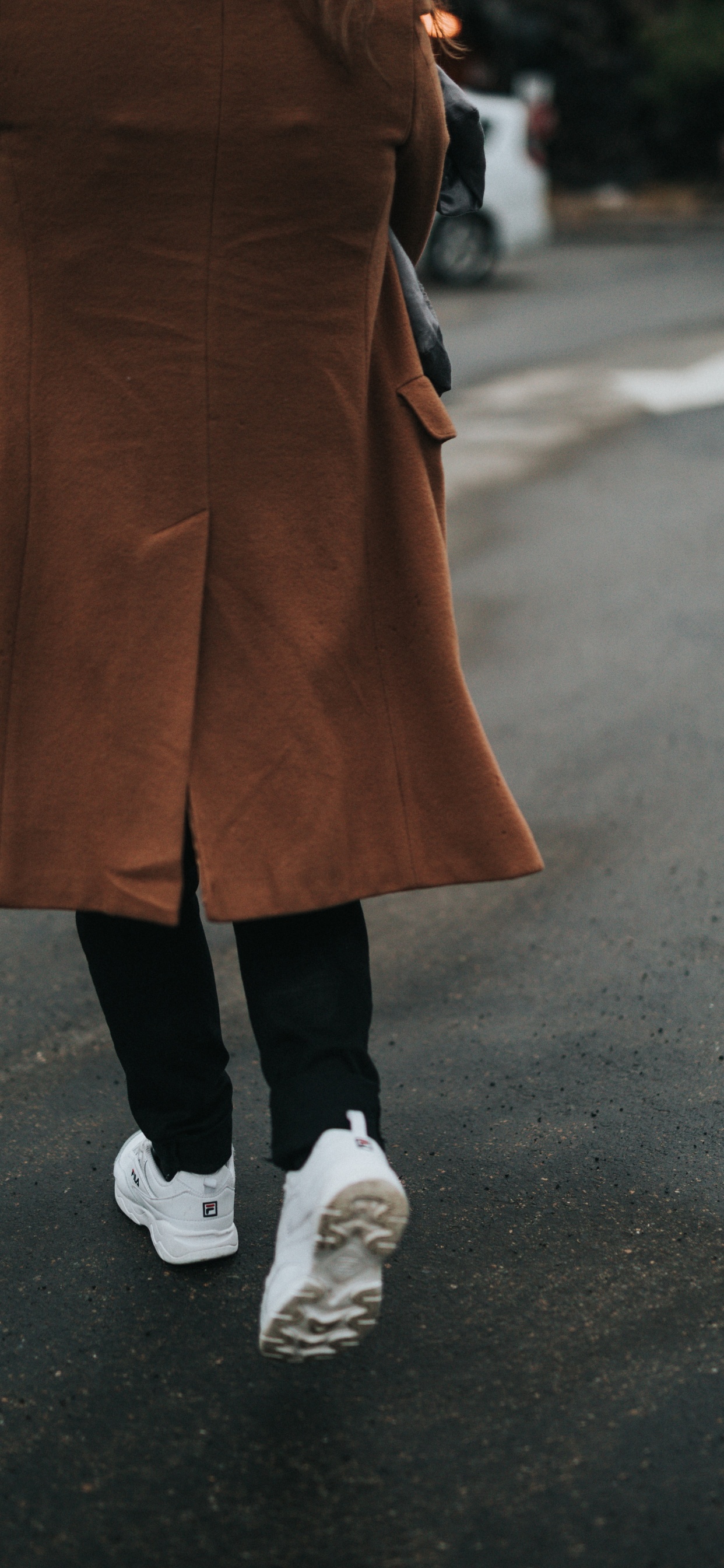 Person in Brown Coat and Black Pants Wearing White Sneakers. Wallpaper in 1242x2688 Resolution