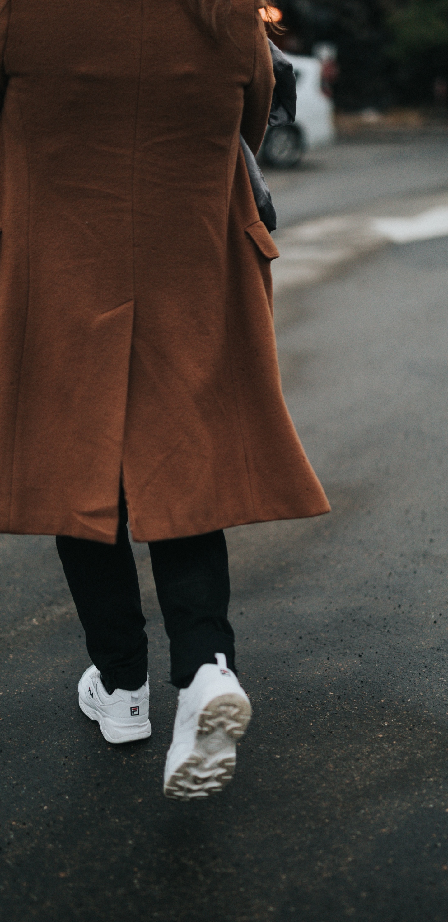 Person in Brown Coat and Black Pants Wearing White Sneakers. Wallpaper in 1440x2960 Resolution