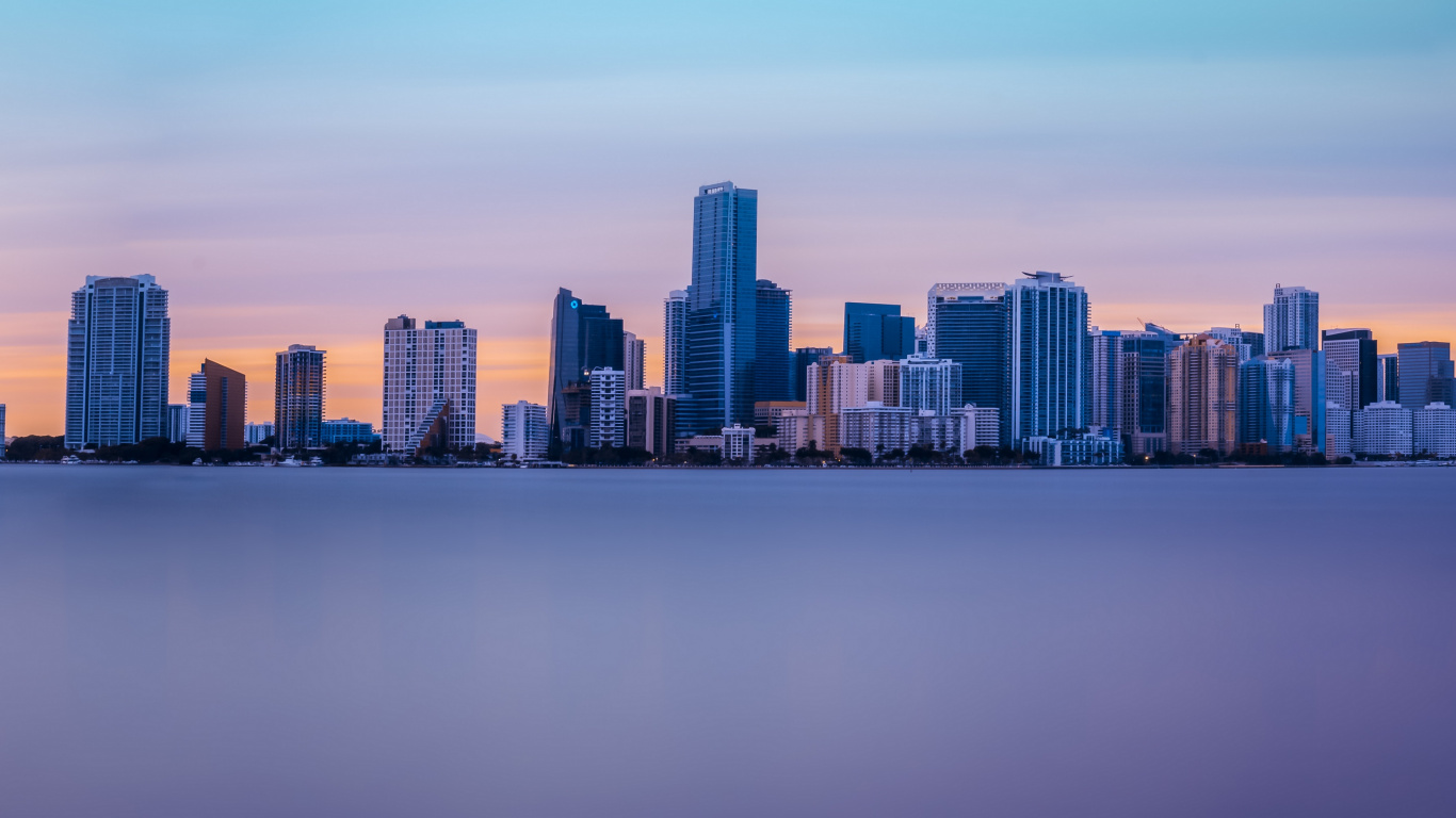 City Skyline Across Body of Water During Daytime. Wallpaper in 1366x768 Resolution