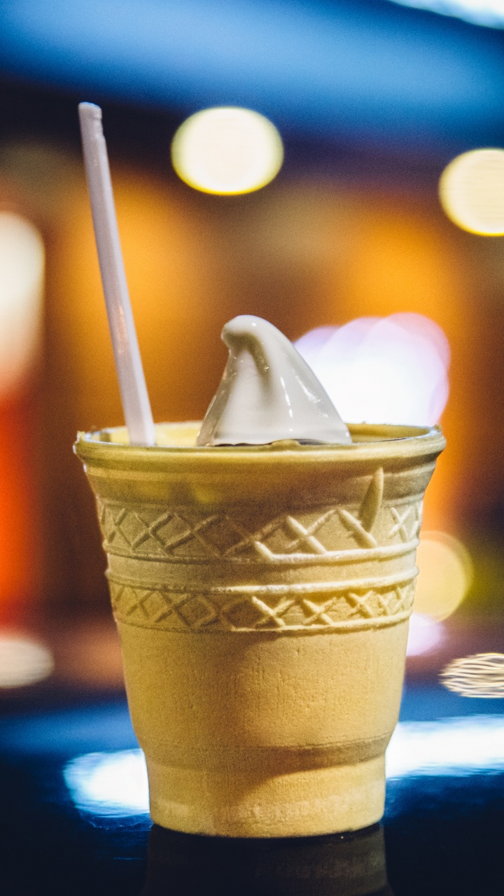 Brown and White Disposable Cup With Ice Cream on Top. Wallpaper in 720x1280 Resolution