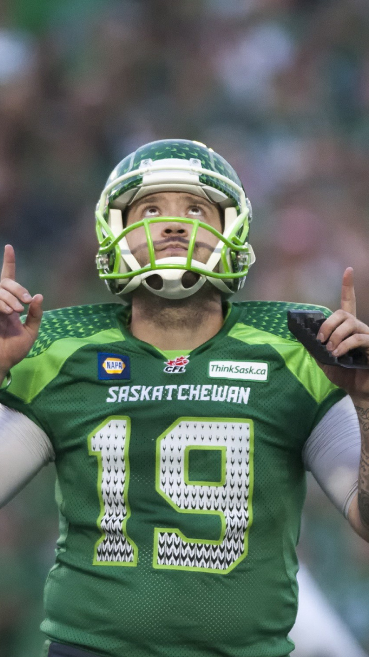 Man in Green and White Football Jersey. Wallpaper in 750x1334 Resolution