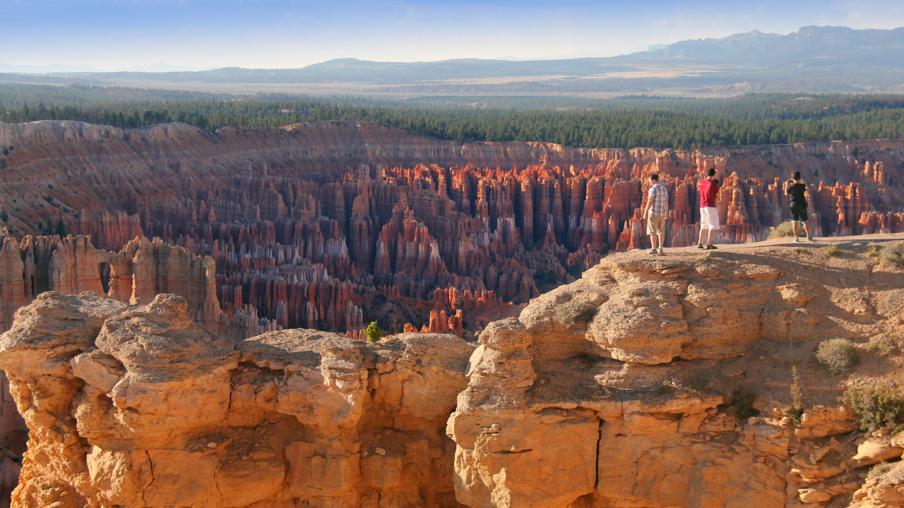 People Standing on Brown Rock Formation During Daytime. Wallpaper in 1280x720 Resolution