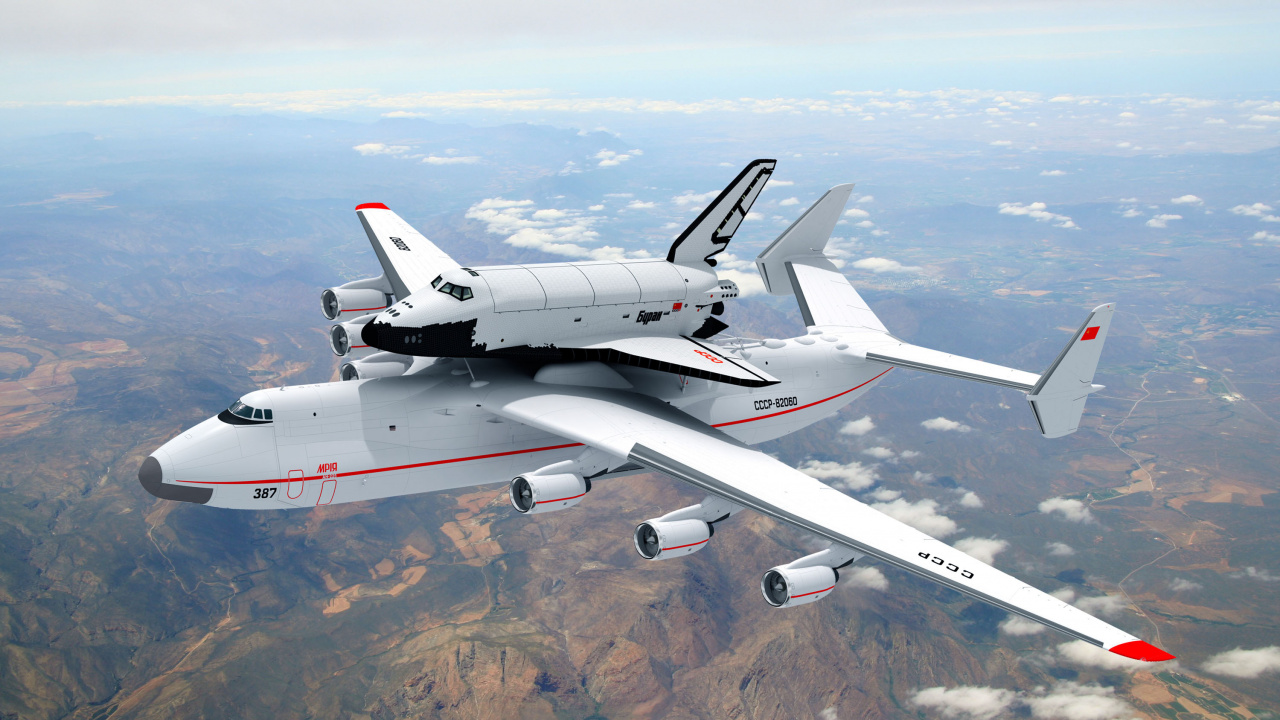 Avion Blanc et Rouge au Sommet de la Montagne Brune Pendant la Journée. Wallpaper in 1280x720 Resolution