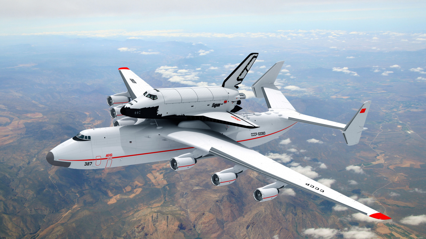 Avion Blanc et Rouge au Sommet de la Montagne Brune Pendant la Journée. Wallpaper in 1366x768 Resolution