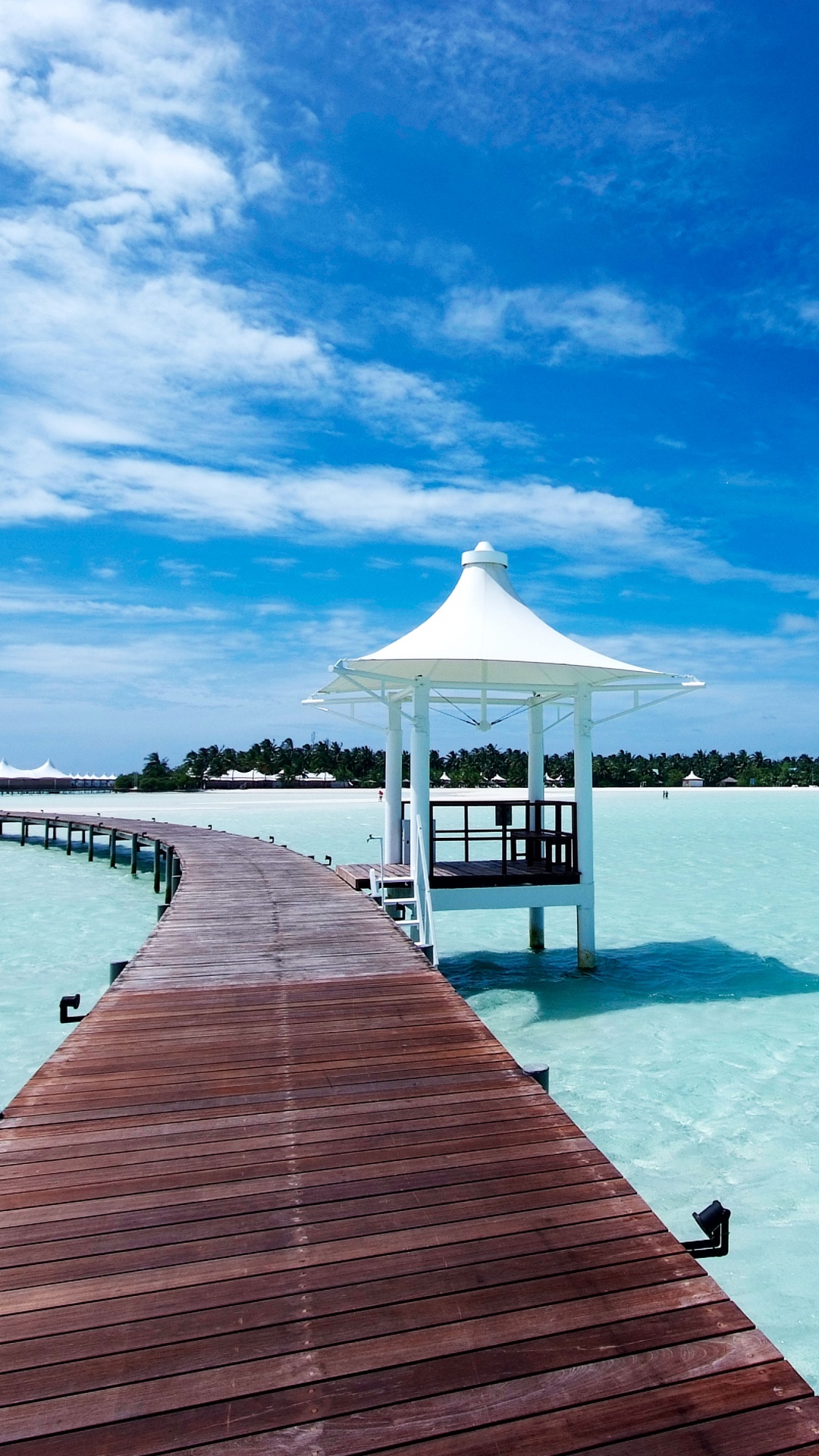 Brown Wooden Dock on Body of Water Under Blue Sky During Daytime. Wallpaper in 1080x1920 Resolution