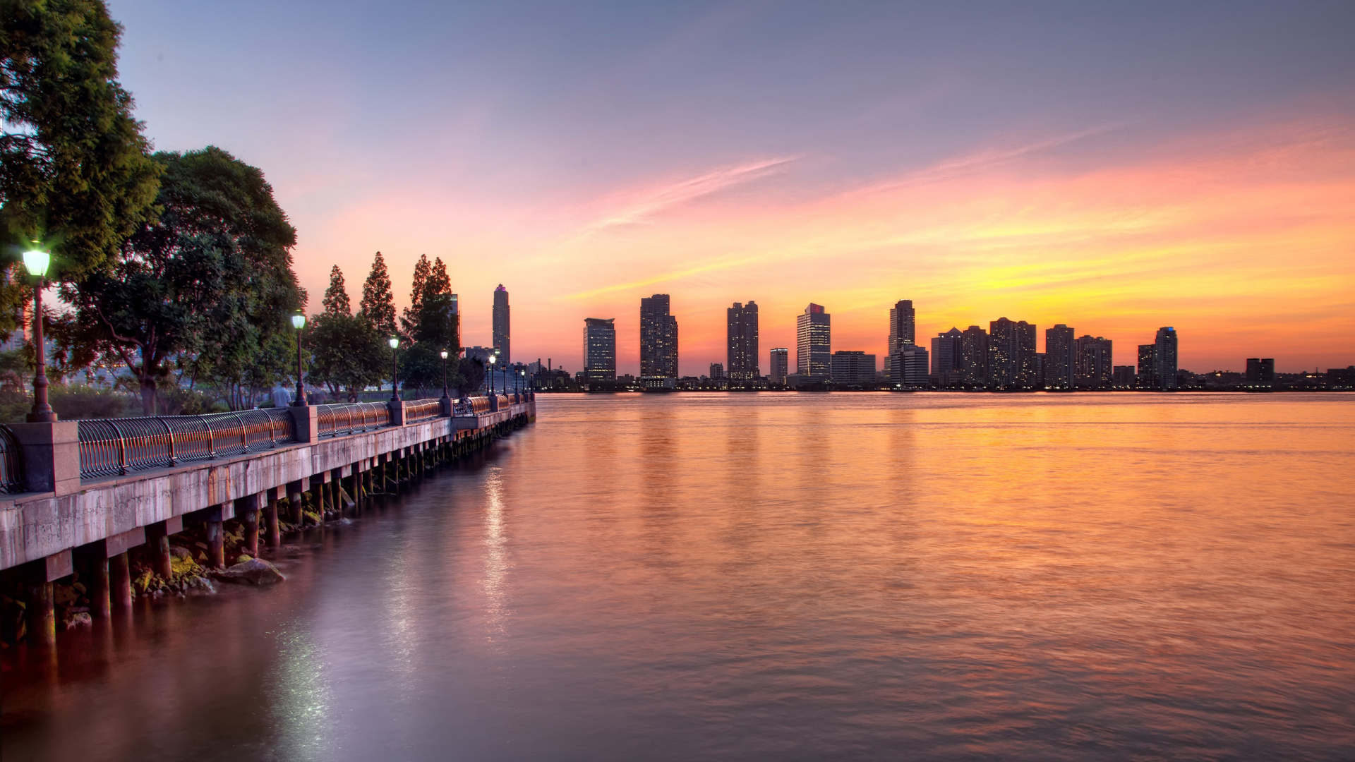 City Skyline Across Body of Water During Night Time. Wallpaper in 1920x1080 Resolution