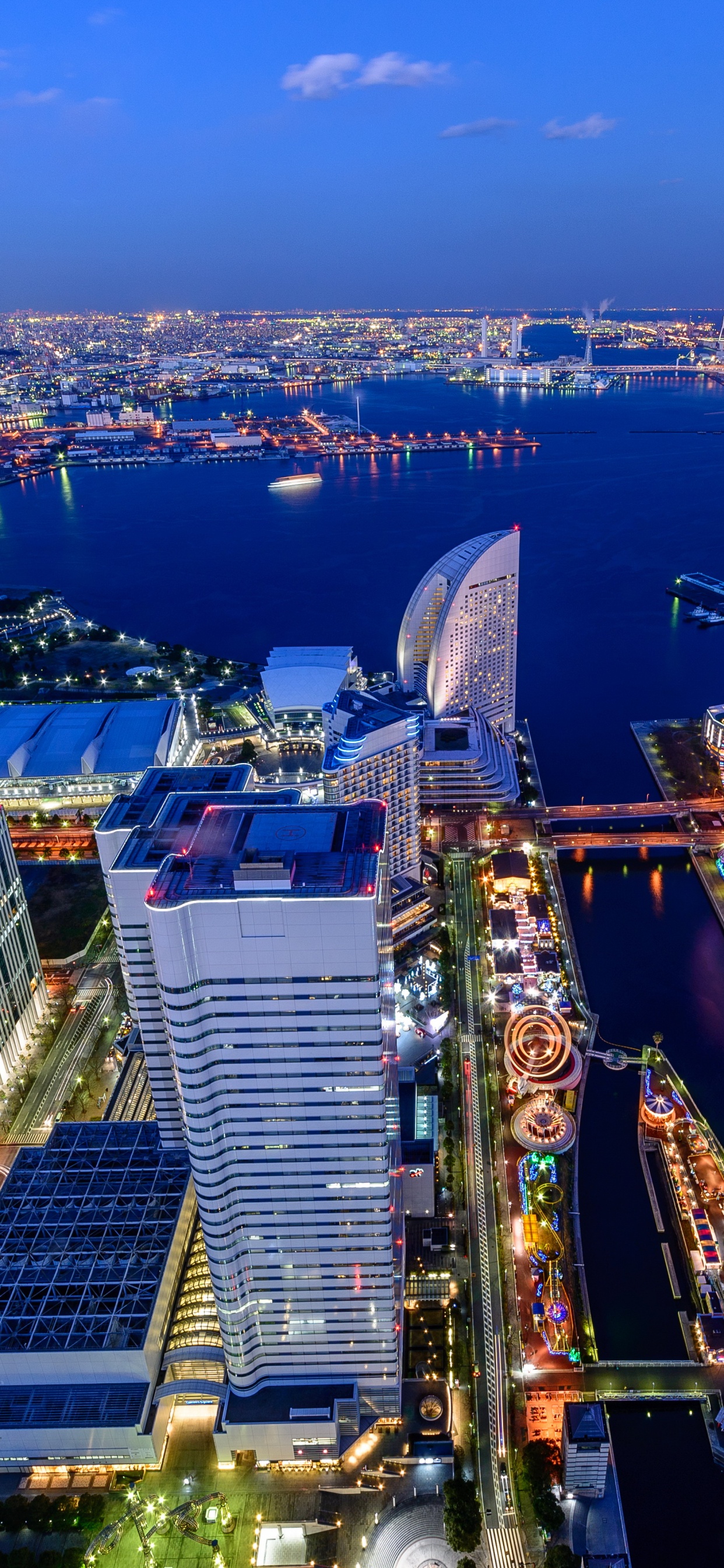 Aerial View of City Buildings During Night Time. Wallpaper in 1242x2688 Resolution
