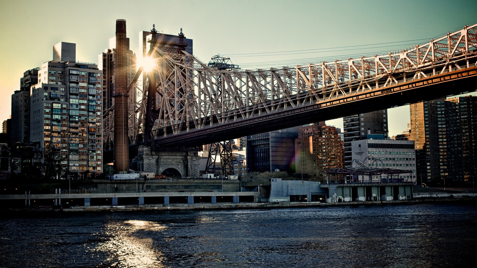 Bridge Over River Near City Buildings During Night Time. Wallpaper in 1920x1080 Resolution
