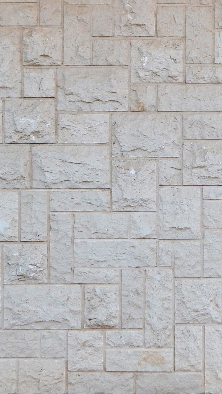 Braune Und Weiße Mauer. Wallpaper in 720x1280 Resolution