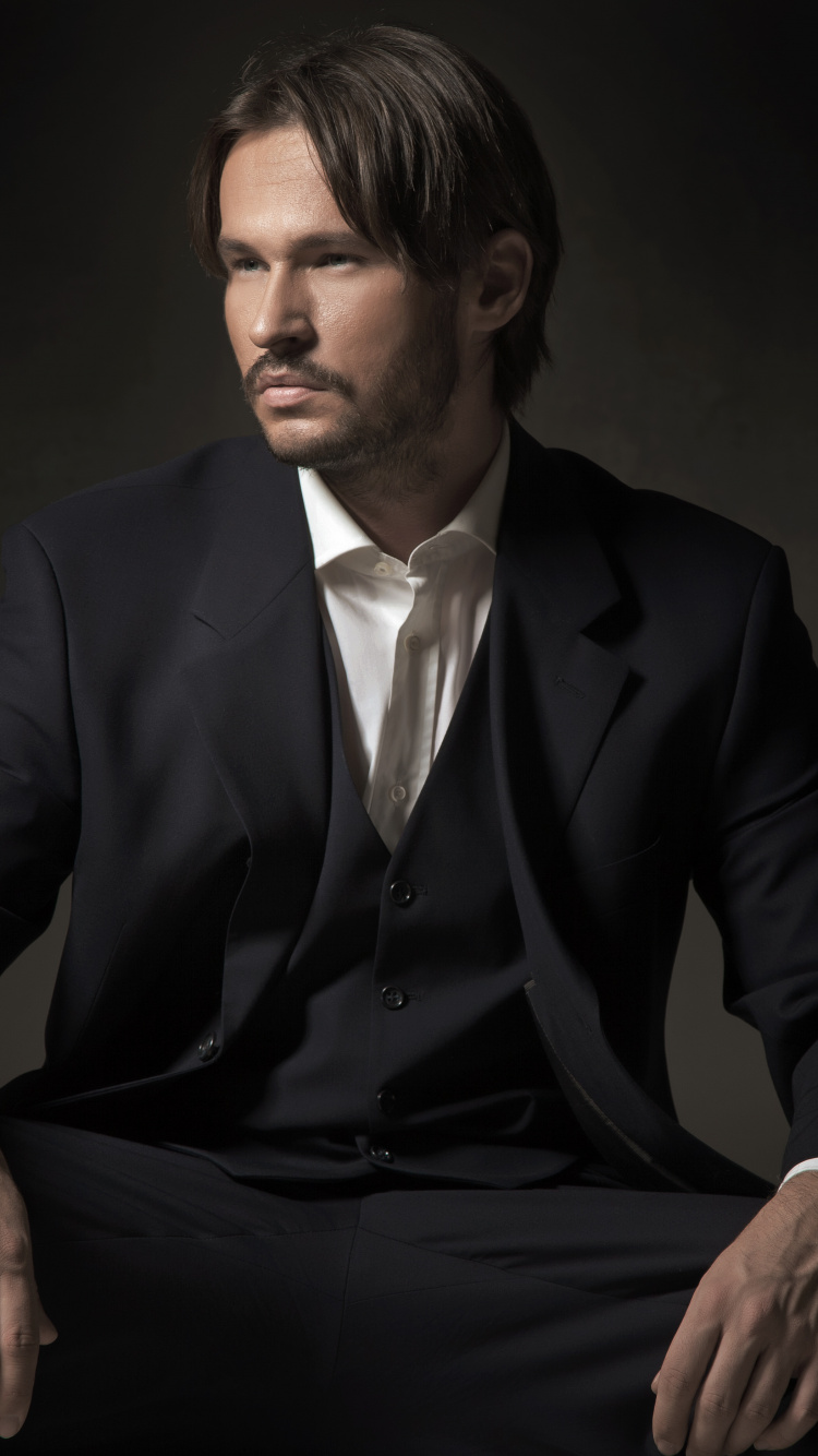 Suit, Sitting, Formal Wear, Tuxedo, Businessperson. Wallpaper in 750x1334 Resolution