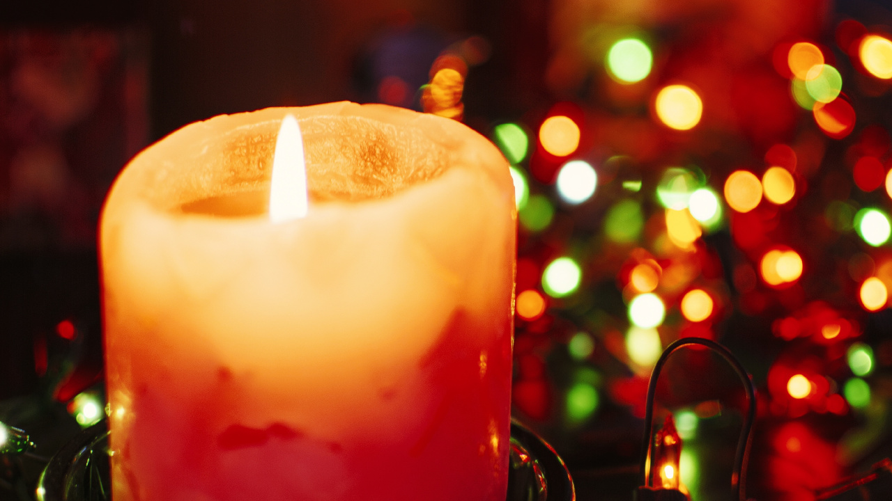 Lighted Candle on Black Metal Candle Holder. Wallpaper in 1280x720 Resolution