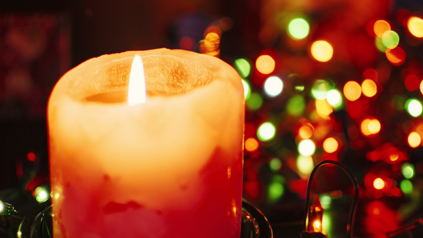 Lighted Candle on Black Metal Candle Holder. Wallpaper in 1366x768 Resolution