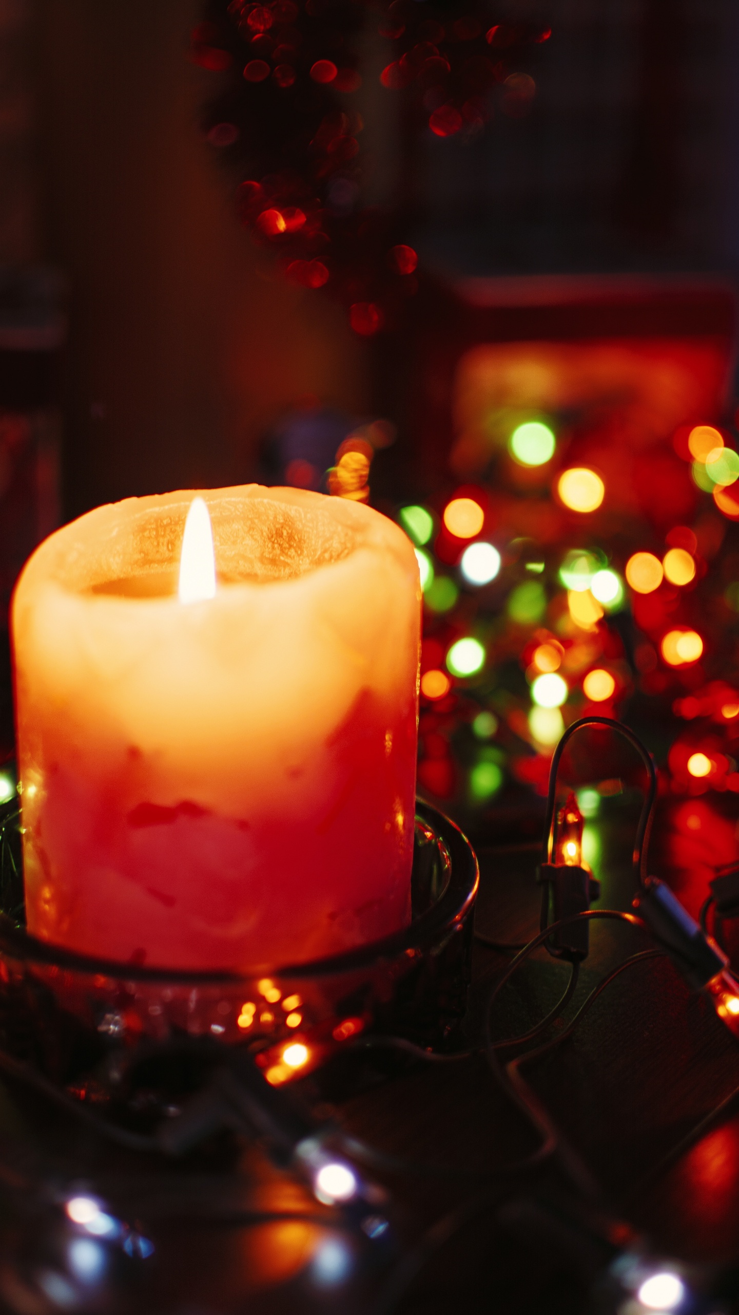 Lighted Candle on Black Metal Candle Holder. Wallpaper in 1440x2560 Resolution