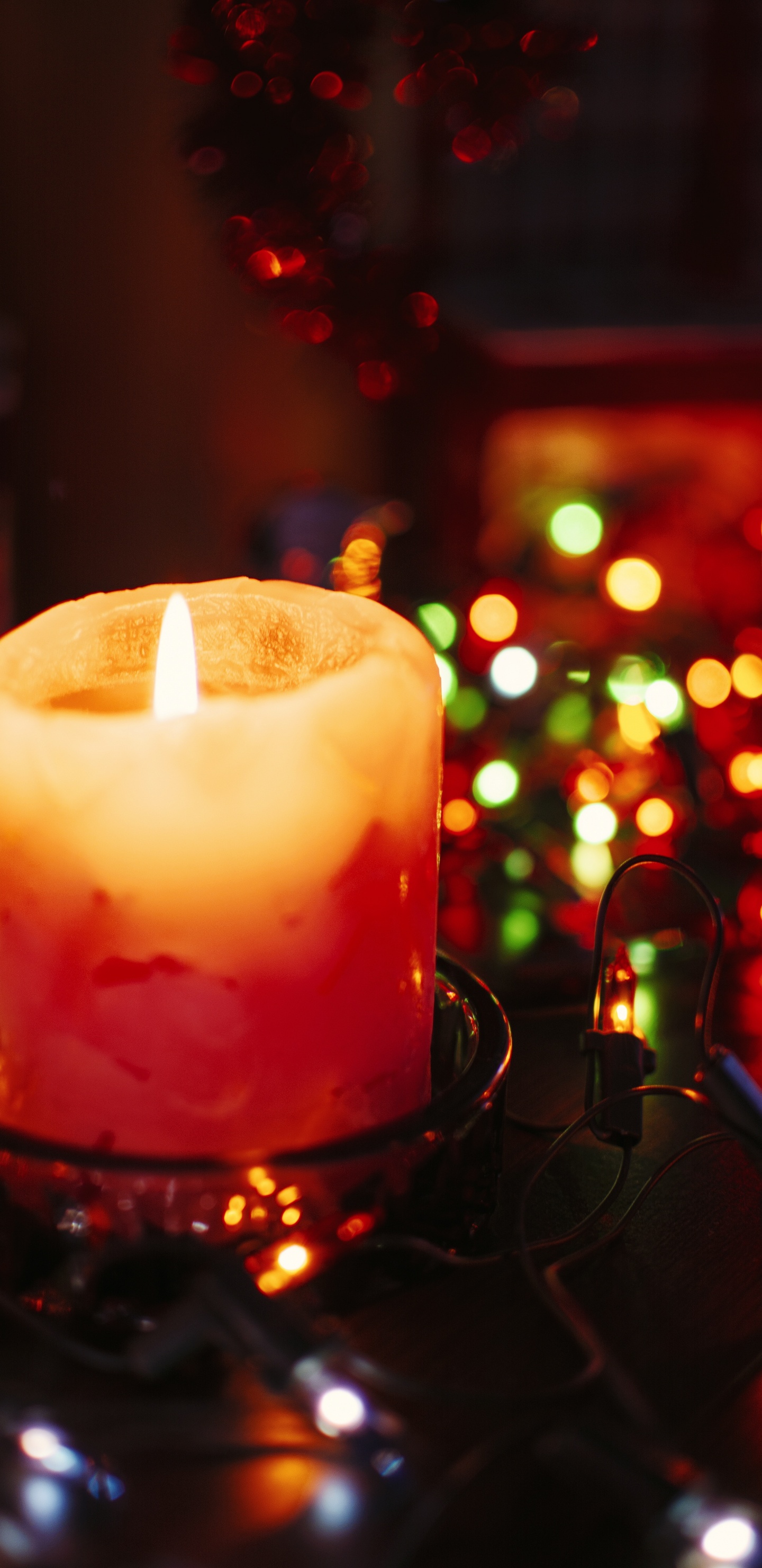 Lighted Candle on Black Metal Candle Holder. Wallpaper in 1440x2960 Resolution