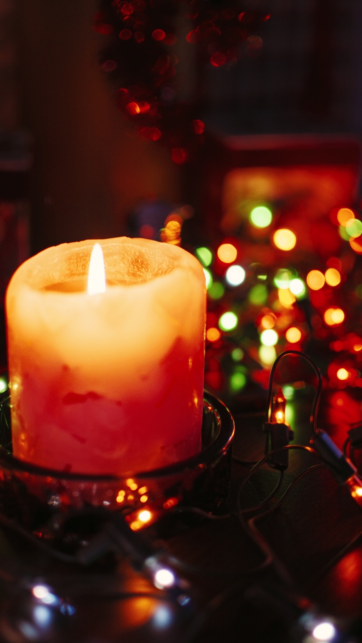 Lighted Candle on Black Metal Candle Holder. Wallpaper in 720x1280 Resolution