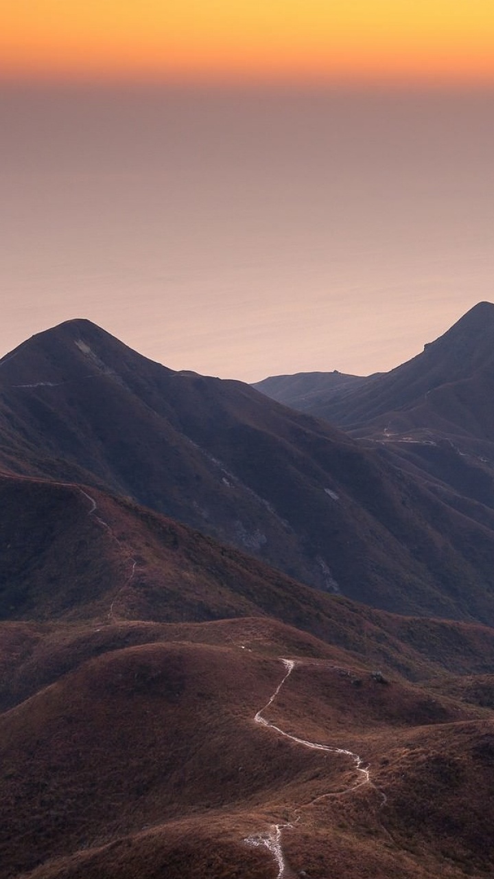 Brown and Green Mountains Near Body of Water During Daytime. Wallpaper in 720x1280 Resolution