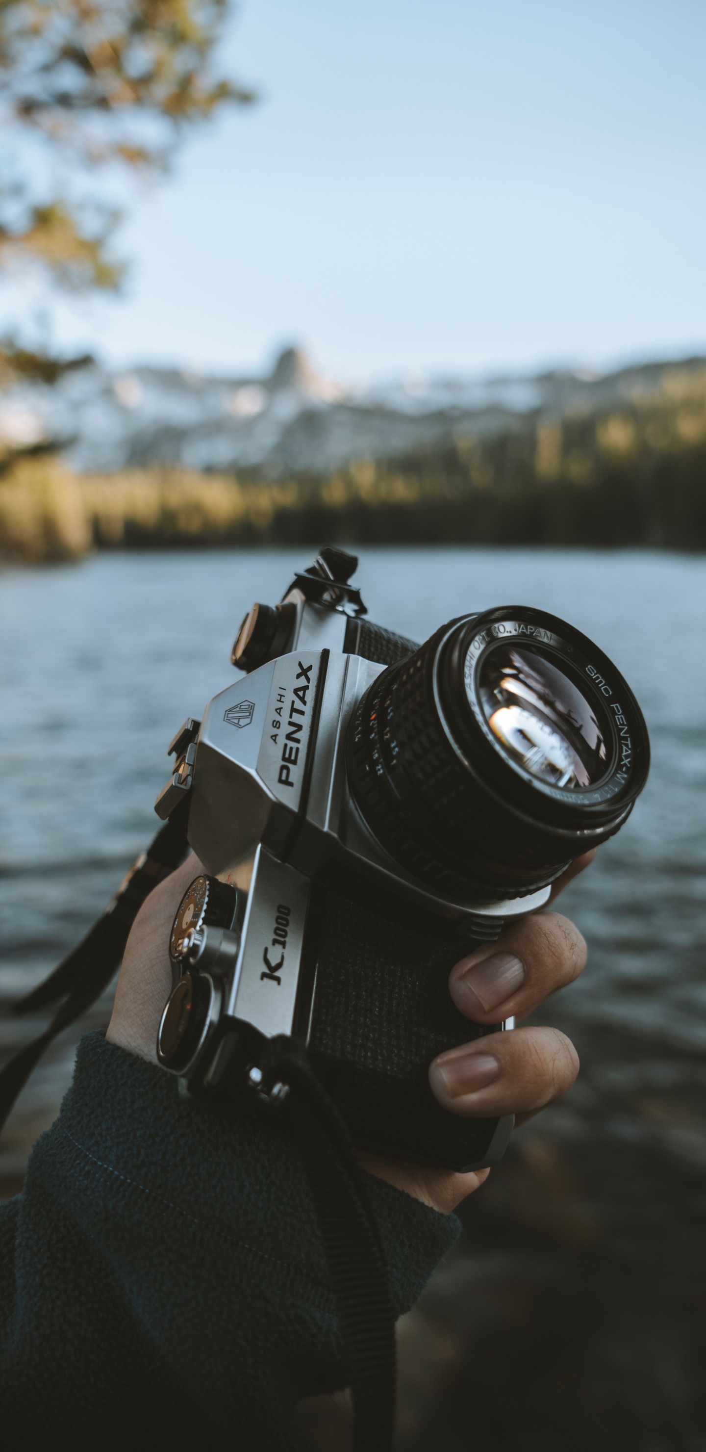 Person Holding Black and Silver Dslr Camera. Wallpaper in 1440x2960 Resolution
