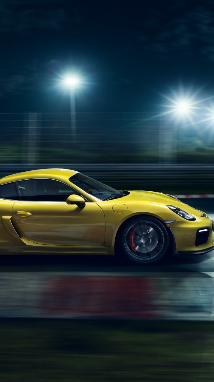 Yellow Porsche 911 on Road at Night. Wallpaper in 720x1280 Resolution