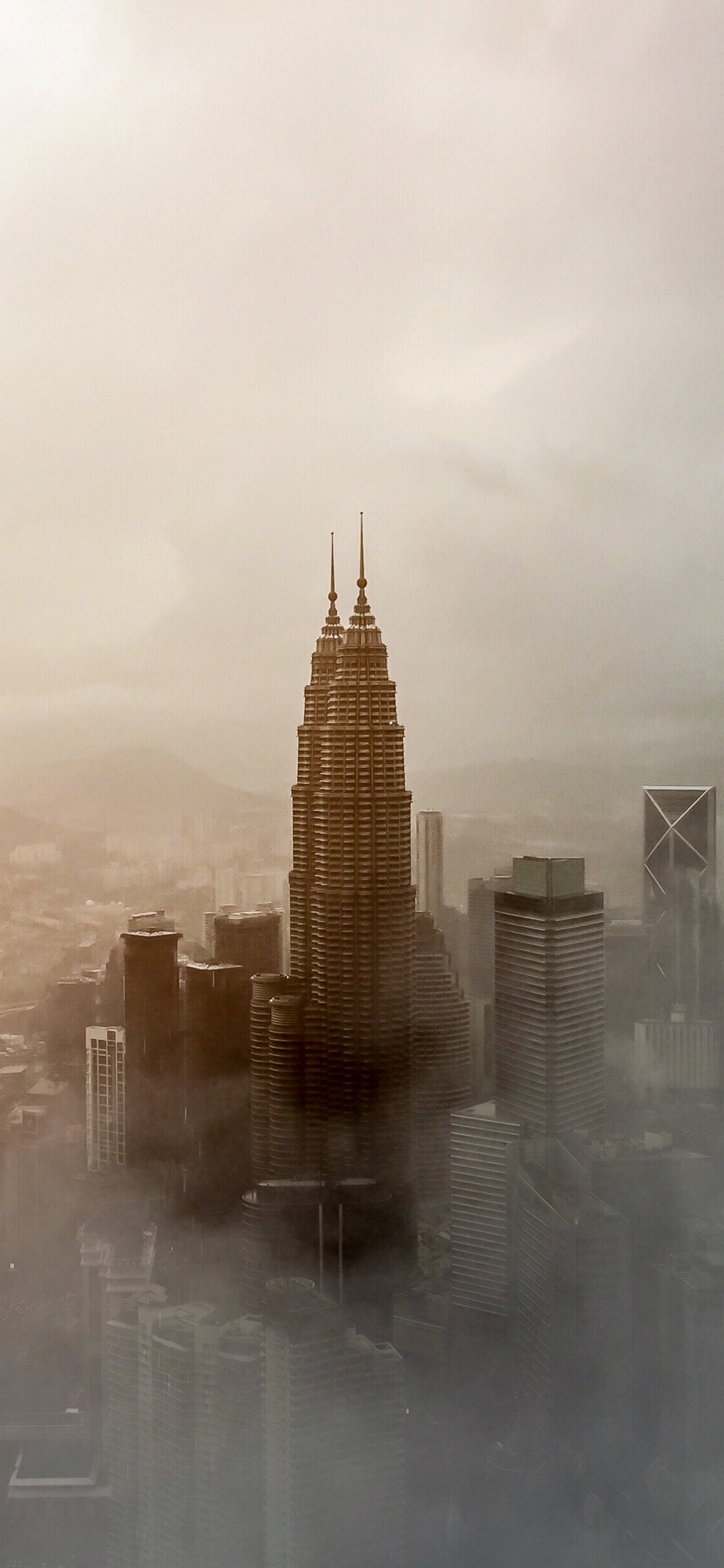 Brown Concrete Building Under White Clouds During Daytime. Wallpaper in 1125x2436 Resolution