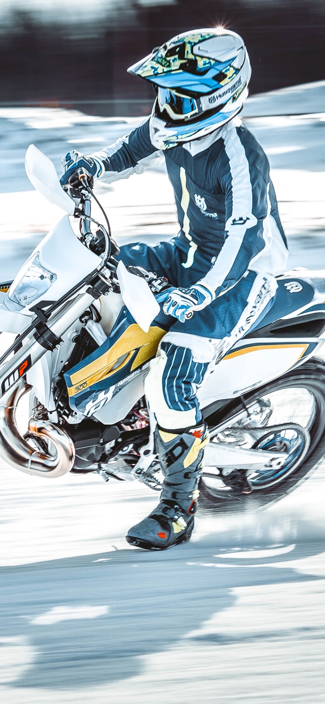 Man in Blue and White Jacket Riding on Orange and Black Motorcycle. Wallpaper in 1125x2436 Resolution