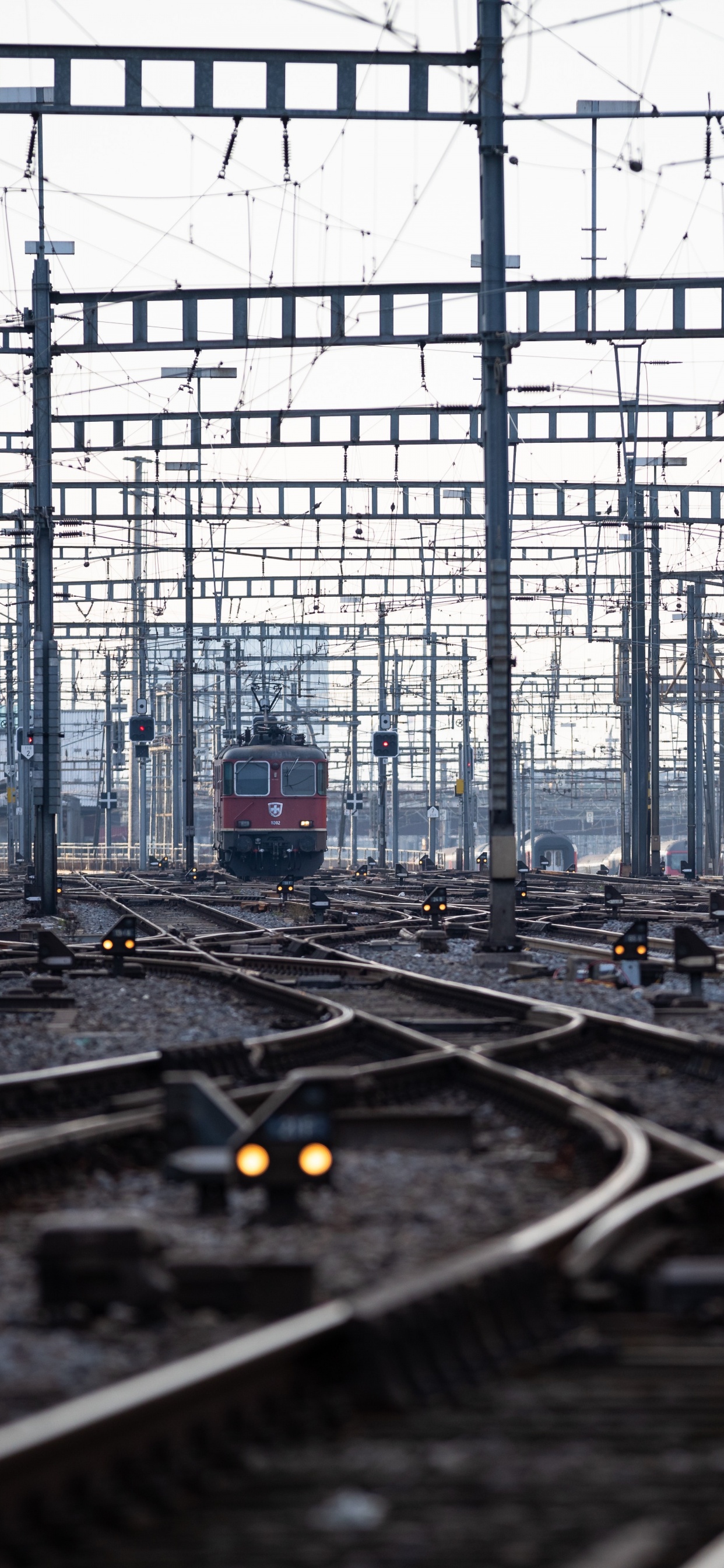 Train Rail Tracks in Train Station. Wallpaper in 1242x2688 Resolution